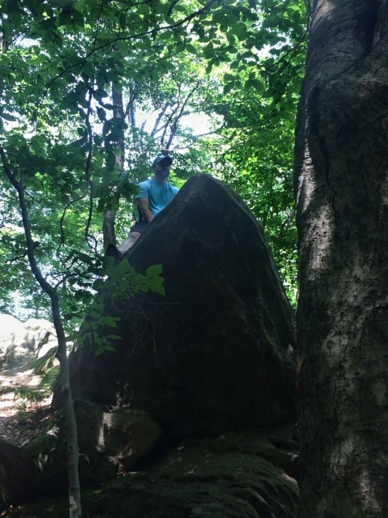 Mike climbing up to explore Panama Rocks
