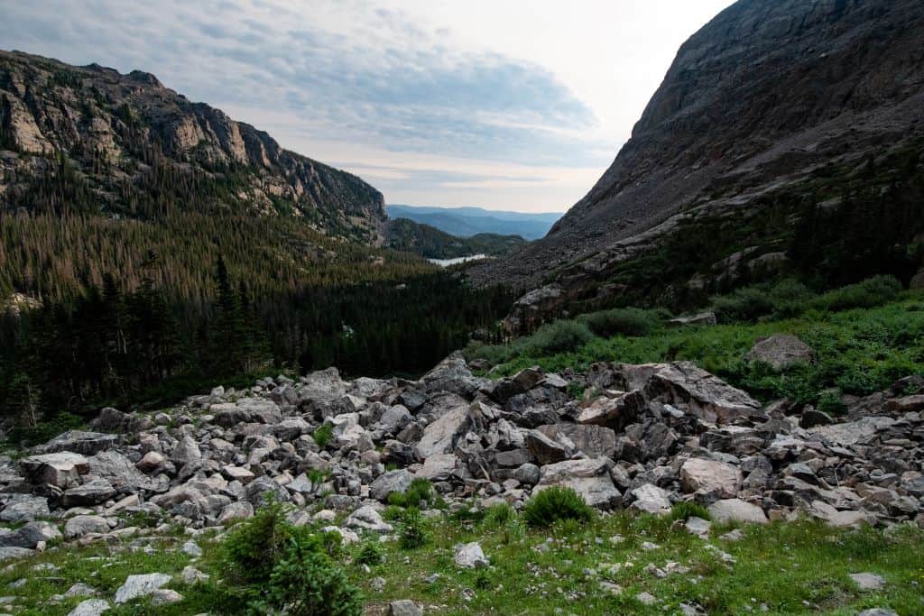 A sweeping rocky view of the small Loch Vale 1 mile in the distance on the way to Sky Pond in Rocky Mountain National Park.