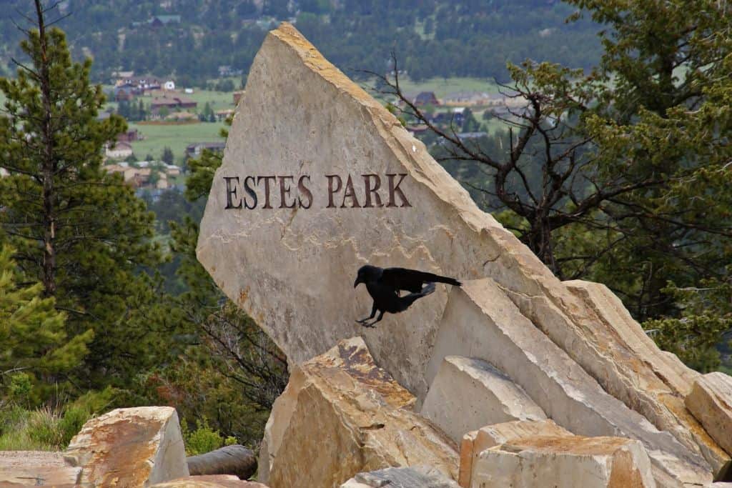 Estes Park Rock signage, marking both the busiest and the closest to popular hikes when comparing Estes Park vs Grand Lake